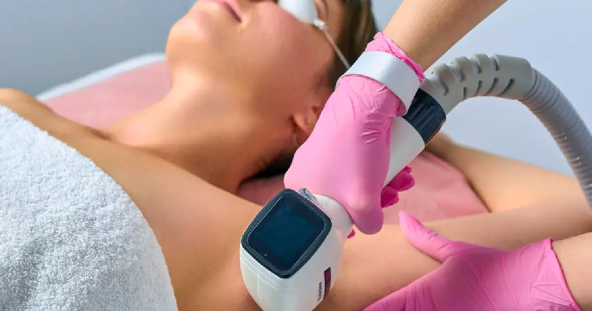 woman receiving laser hair removal on her underarm using a Diolaze device in Madisonville, LA